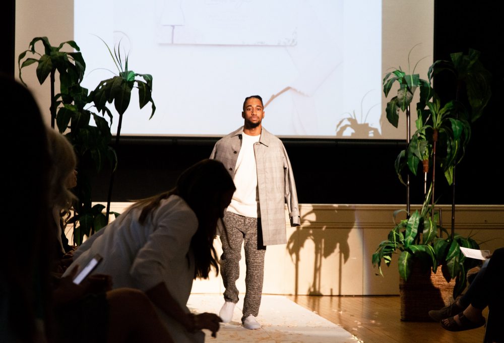 Man walks down the runway