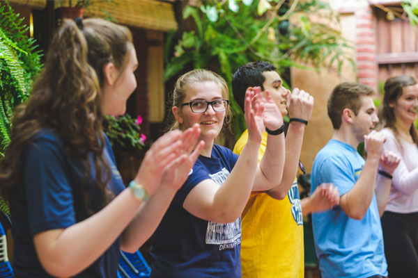 A group of students practice their dance moves