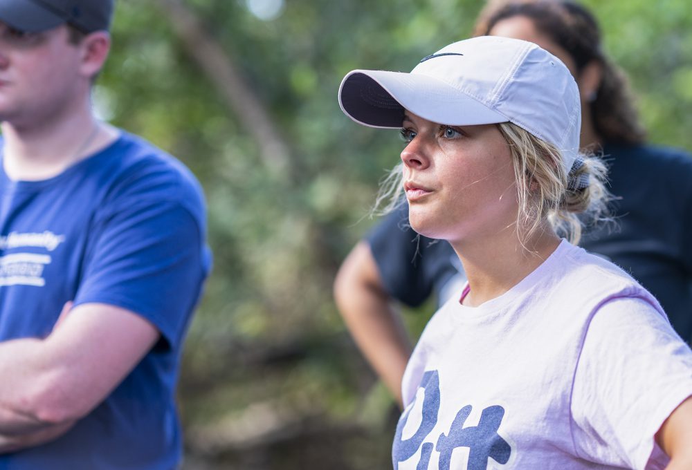 Students listen to instructions in an urban wetland in Puerto Rico
