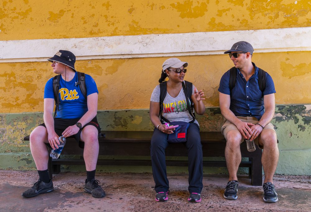 Students pause for a break on a bench in the old San Juan district of Puerto Rico