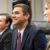 Pitt Business students smiling at a conference room table
