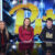 Pitt students behind the desk of the Pitt athletics sports studio space
