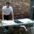 Student Connor Murray selling cassette tapes and merchandise at a table