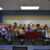 The class gathers in the front of the room together